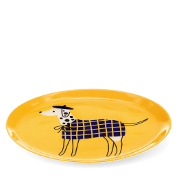 Oval yellow metal tray featuring an illustrated spotted dog wearing a blue checked coat and beret.