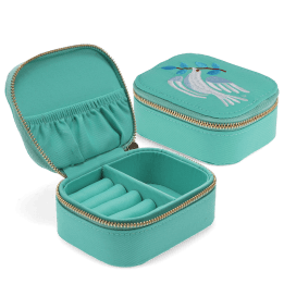 Open jewellery box with embroidered dove design, ring rolls and storage compartments.