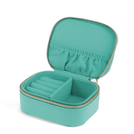 Open turquoise jewellery box with ring rolls, storage compartments and interior pockets.