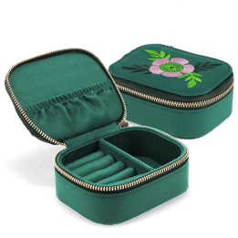 Open jewellery box with embroidered floral design, ring rolls and storage compartments.