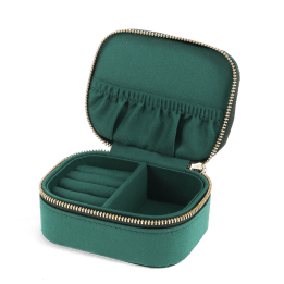 Open dark green jewellery box with ring rolls, storage compartment and interior pockets.