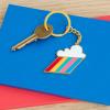 Cloud burst keyring on table with key attached