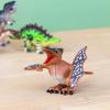 Pterodactyl wind up toy and a green Stegosaurus in the back