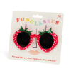 Red strawberry-shaped funglasses with green leaves, and dark round lenses with packaging