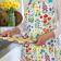 Wild Flowers Recycled Cotton Apron worn by adult holding baked goods