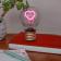 Heart usb light bulb placed on a book with light on