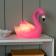 Pink flamingo night light shown with light on