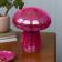 Pink disco mushroom-shaped table lamp with mirrored tiles.