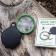 Nature Trail pocket magnifying glass with green frame, black leather case, and illustrated packaging.