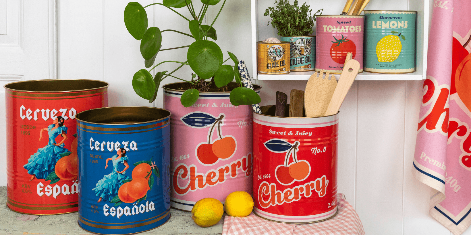 Bright storage tins sit on a shelf filled with plants and utensils