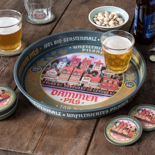Round metal serving tray with vintage German beer design and colorful town illustration