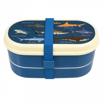 Dark blue kids bento box with cream lid and middle tray plus dark blue elastic strap featuring images of sharks