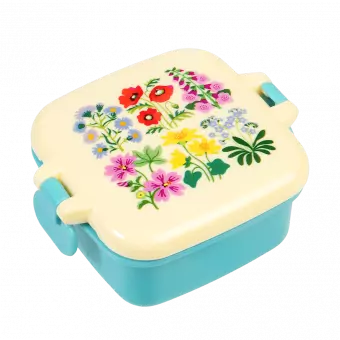 Turquoise snack pot with cream lid featuring wild flower pattern