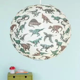 White paper lampshade with dinosaur decoration installed in room