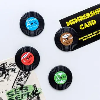 Four colourful mini vinyl record magnets  