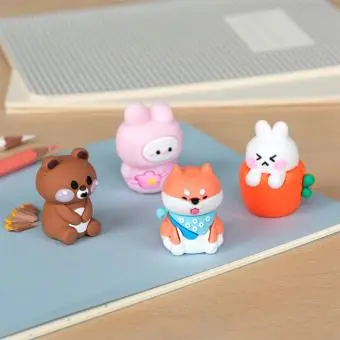 Four animal-themed pencil sharpeners—a brown bear, pink bunny, dog and rabbit