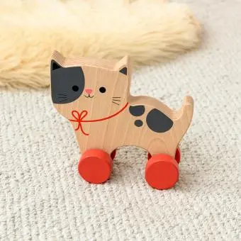 wooden push-along cat toy with red wheels