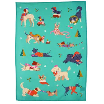 cotton tea towel featuring festive dog print in a green background