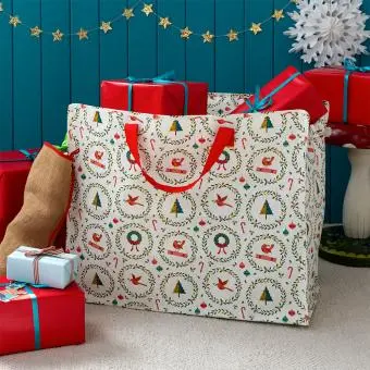 Christmas storage bag with classic designs, filled with presents
