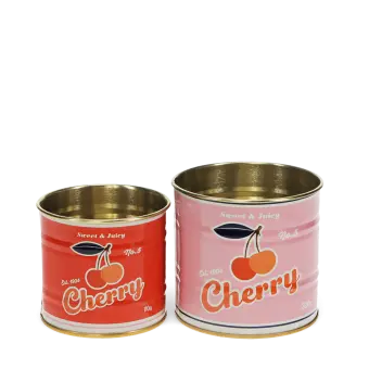 Two vintage-style cherry-themed storage tins, one small red and one larger pink