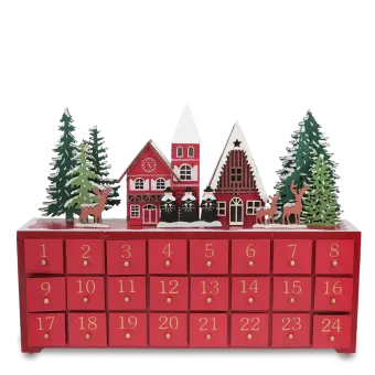 Wooden advent calendar with 24 red drawers numbered in gold, featuring snow-covered houses, trees, and reindeer