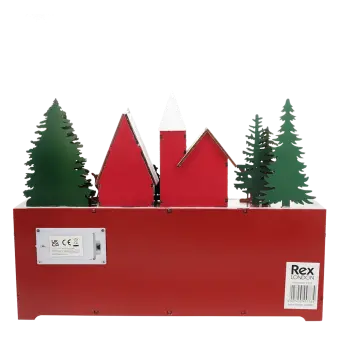 Back of a wooden advent calendar featuring green trees and red houses, with a battery compartment and a barcode label 