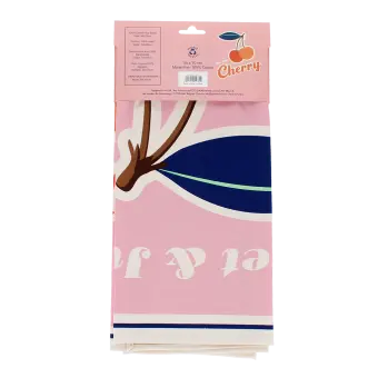 Cotton tea towel featuring a cherry print with pink background in a packaging