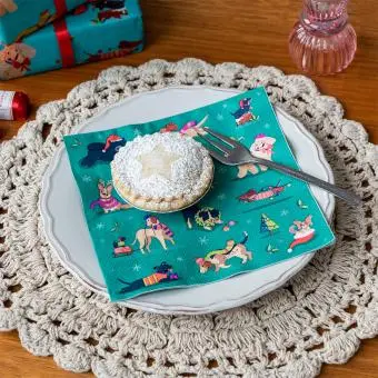 festive friends napkins feature illustrations of different dogs in winter clothing