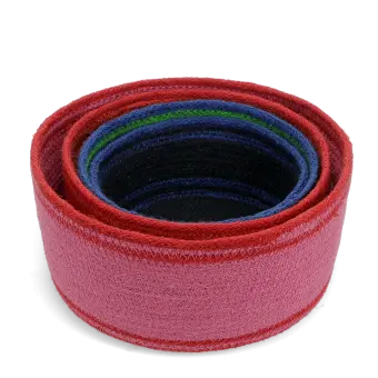 Stacked woven storage baskets in varying sizes and colours