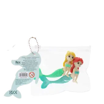 Mermaid-shaped erasers in a clear pouch with a tag showing safety warning in multilangual