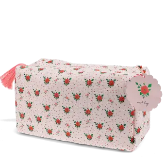 Rectangular makeup bag in pale pink with a floral pattern of small red and green flowers with tag