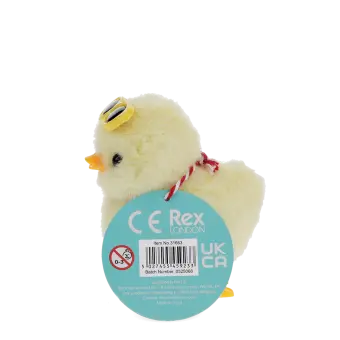 A fluffy yellow wind-up duck toy wearing yellow sunglasses with a tag 