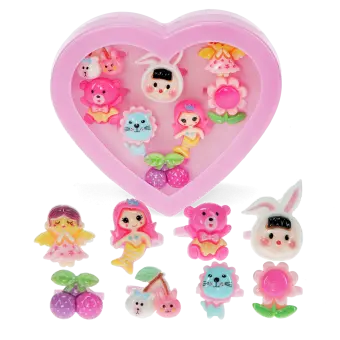 Assorted colourful rings with animal, mermaid, flower, and fruit designs in a pink heart-shaped box