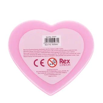 Back of rings in pink heart-shaped box with safety warnings and manufacturer details in multiple languages.