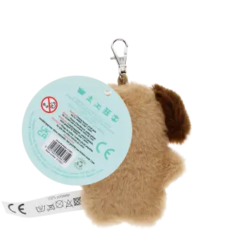 dog-shaped plush keyring wearing a tie with brown ears and a tag with safety warnings