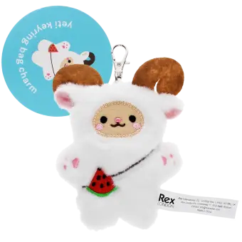 Yeti-shaped plush keyring with pink ears and paws, a watermelon accessory with metal clasp and a tag