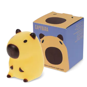 Yellow capybara night light with dark brown ears, shown next to its yellow packaging box 