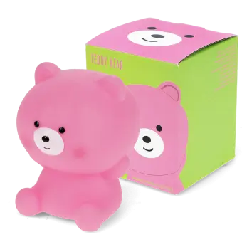 Pink teddy bear night light shown next to its packaging box 