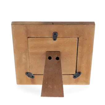 Back of a wooden square picture frame with black metal clips and a stand 