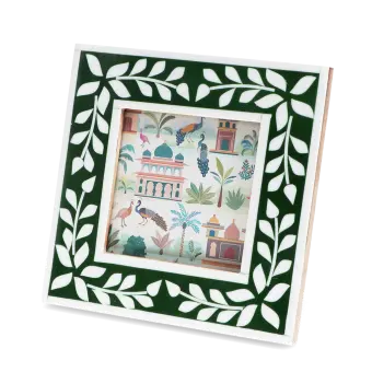 Square green picture frame with white leaf patterns on the border.