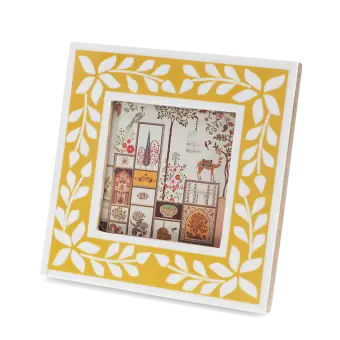 Square picture frame with white leaf patterns and mustard yellow colour on the border.