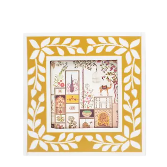 Square picture frame with white leaf patterns and mustard yellow colour on the border.