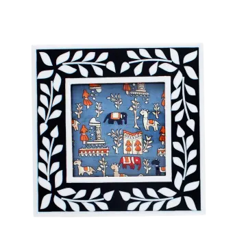 Square picture frame with white leaf patterns and navy blue colour on the border.