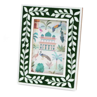 picture frame with a green border and white leaf patterns
