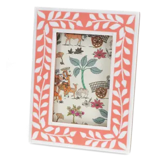 picture frame with a pink border and white leaf patterns