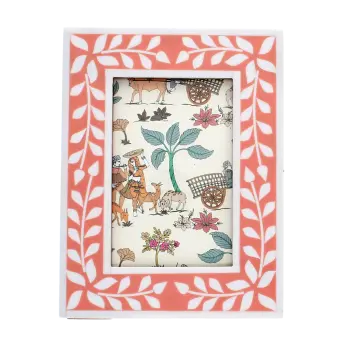picture frame with a pink border and white leaf patterns