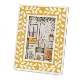 picture frame with a mustard yellow border and white leaf patterns