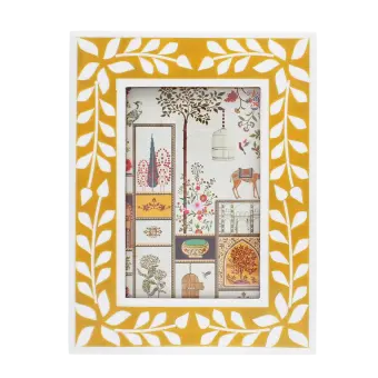 picture frame with a mustard yellow border and white leaf patterns