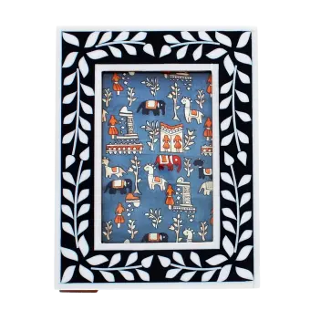 picture frame with a navy blue border and white leaf patterns