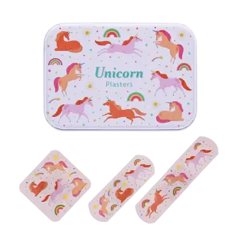 Unicorn-printed plasters placed beside a matching storage tin featuring rainbow and unicorn illustrations